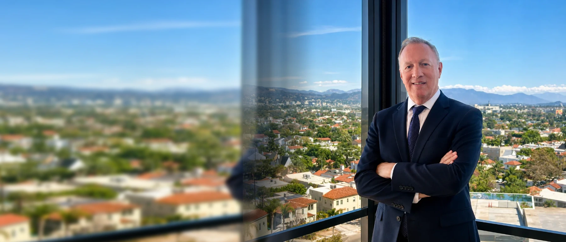 Philip Kaufler standing with arms crossed in his Beverly Hills office